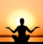 woman-meditating-sunset